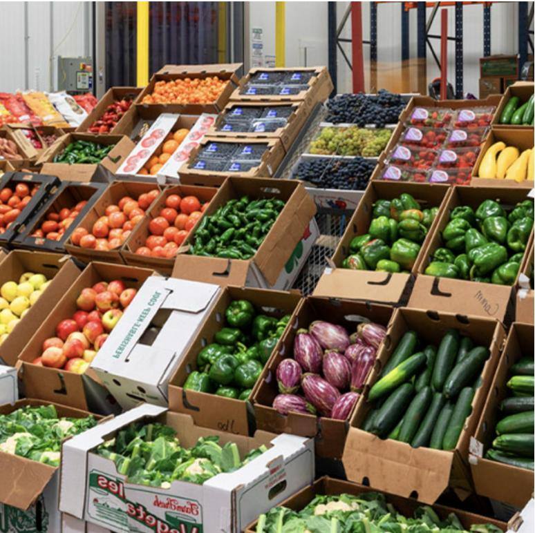 Crates of fresh fruit and vegetables at a wholesale market